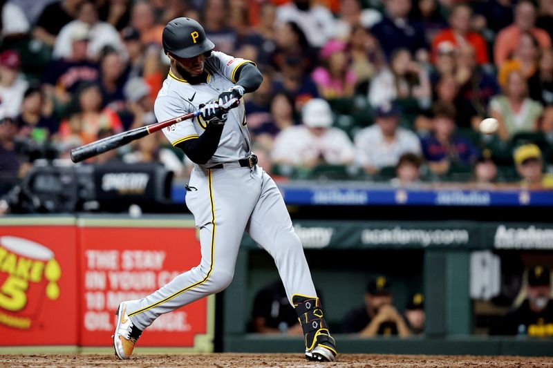 Jul 31, 2024; Houston, Texas, USA; Pittsburgh Pirates right fielder Bryan De La Cruz (41) hits a single against the Houston Astros during the eighth inning at Minute Maid Park. Mandatory Credit: Erik Williams-USA TODAY Sports