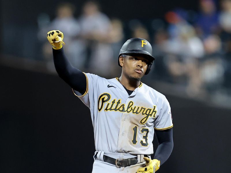 Aug 14, 2023; New York City, New York, USA; Pittsburgh Pirates third baseman Ke'Bryan Hayes (13) reacts after hitting an RBI double against the New York Mets during the third inning at Citi Field. Mandatory Credit: Brad Penner-USA TODAY Sports