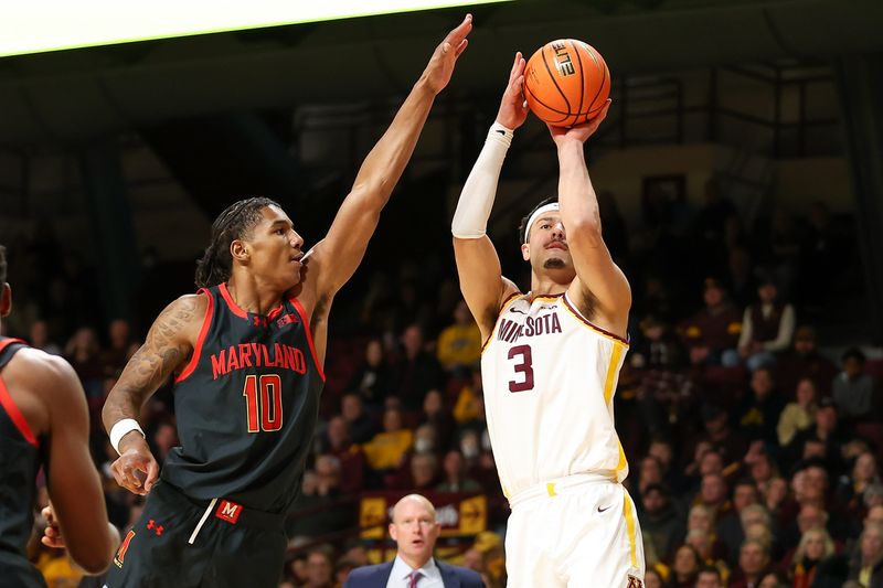 Jan 7, 2024; Minneapolis, Minnesota, USA; Minnesota Golden Gophers forward Dawson Garcia (3) shoots as Maryland Terrapins forward Julian Reese (10) defends during the first half at Williams Arena. Mandatory Credit: Matt Krohn-USA TODAY Sports