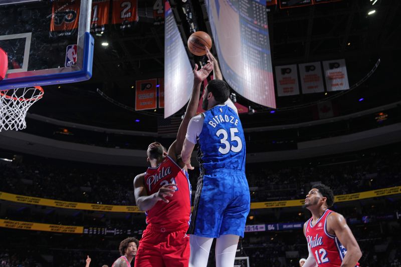 PHILADELPHIA, PA - APRIL 12: Goga Bitadze #35 of the Orlando Magic drives to the basket during the game against the Philadelphia 76ers on April 12, 2024 at the Wells Fargo Center in Philadelphia, Pennsylvania NOTE TO USER: User expressly acknowledges and agrees that, by downloading and/or using this Photograph, user is consenting to the terms and conditions of the Getty Images License Agreement. Mandatory Copyright Notice: Copyright 2024 NBAE (Photo by Jesse D. Garrabrant/NBAE via Getty Images)