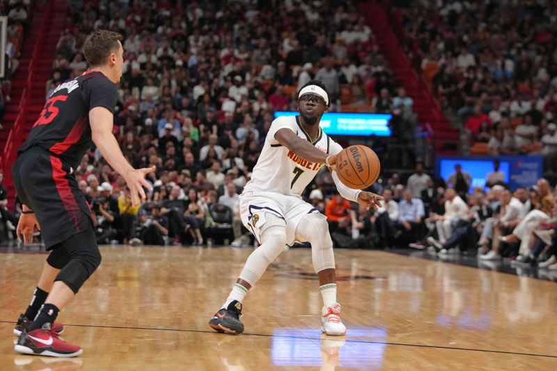 MIAMI, FL - MARCH 13: Reggie Jackson #7 of the Denver Nuggets looks to pass the ball during the game against the Miami Heat on March 13, 2024 at Kaseya Center in Miami, Florida. NOTE TO USER: User expressly acknowledges and agrees that, by downloading and or using this Photograph, user is consenting to the terms and conditions of the Getty Images License Agreement. Mandatory Copyright Notice: Copyright 2024 NBAE (Photo by Eric Espada/NBAE via Getty Images)