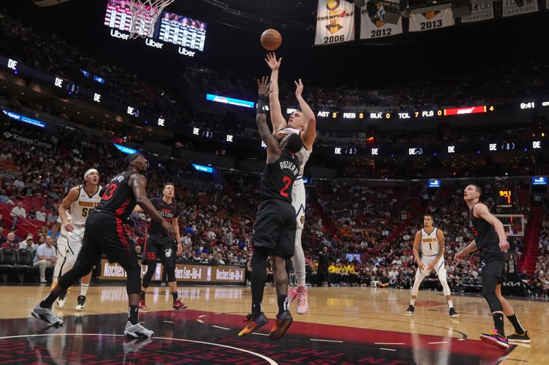 MIAMI, FL - MARCH 13: Nikola Jokic #15 of the Denver Nuggets shoots the ball during the game against the Miami Heat on March 13, 2024 at Kaseya Center in Miami, Florida. NOTE TO USER: User expressly acknowledges and agrees that, by downloading and or using this Photograph, user is consenting to the terms and conditions of the Getty Images License Agreement. Mandatory Copyright Notice: Copyright 2024 NBAE (Photo by Eric Espada/NBAE via Getty Images)