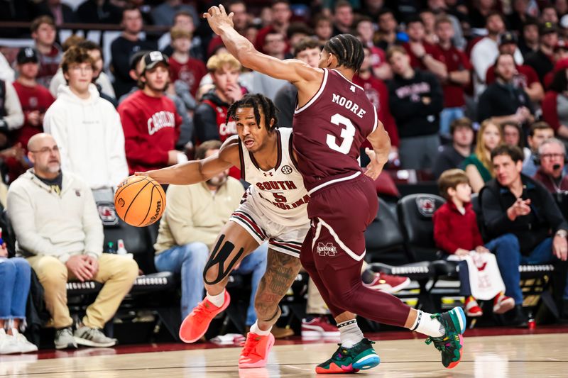 Jan 6, 2024; Columbia, South Carolina, USA; South Carolina Gamecocks guard Meechie Johnson (5) drives around Mississippi State Bulldogs guard Shakeel Moore (3) in the first half at Colonial Life Arena. Mandatory Credit: Jeff Blake-USA TODAY Sports