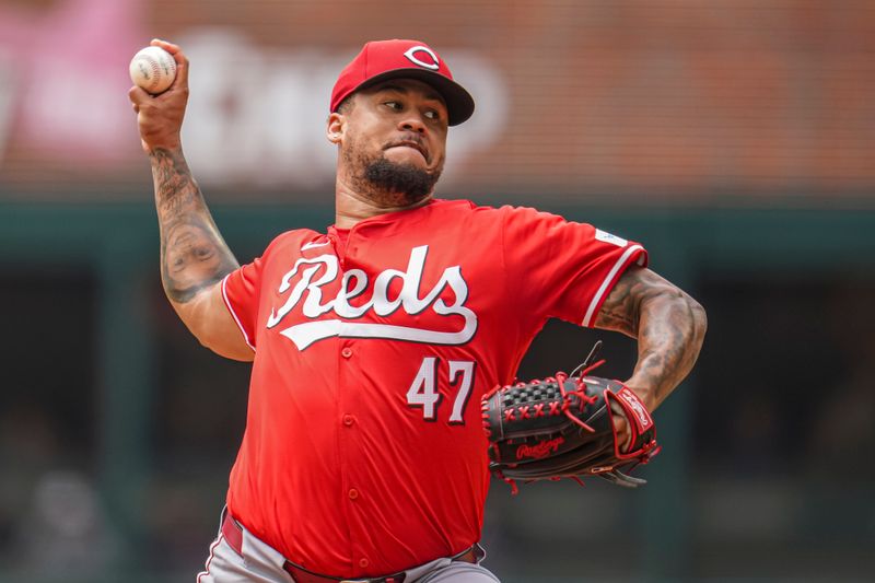 Jul 24, 2024; Cumberland, Georgia, USA; Cincinnati Reds starting pitcher Frankie Montas (47) pitches against the Atlanta Braves during the first inning at Truist Park. Mandatory Credit: Dale Zanine-USA TODAY Sports