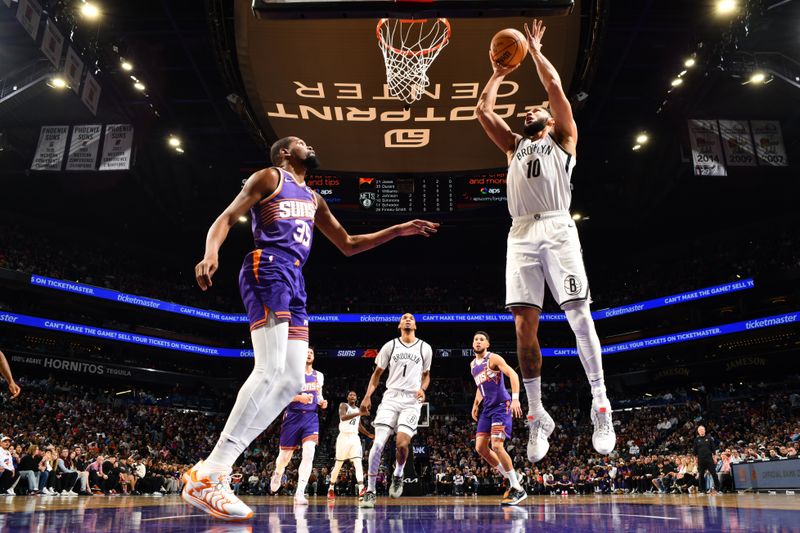 PHOENIX, AZ - NOVEMBER 27: Ben Simmons #10 of the Brooklyn Nets drives to the basket during the game against the Phoenix Suns on November 27, 2024 at Footprint Center in Phoenix, Arizona. NOTE TO USER: User expressly acknowledges and agrees that, by downloading and or using this photograph, user is consenting to the terms and conditions of the Getty Images License Agreement. Mandatory Copyright Notice: Copyright 2024 NBAE (Photo by Barry Gossage/NBAE via Getty Images)