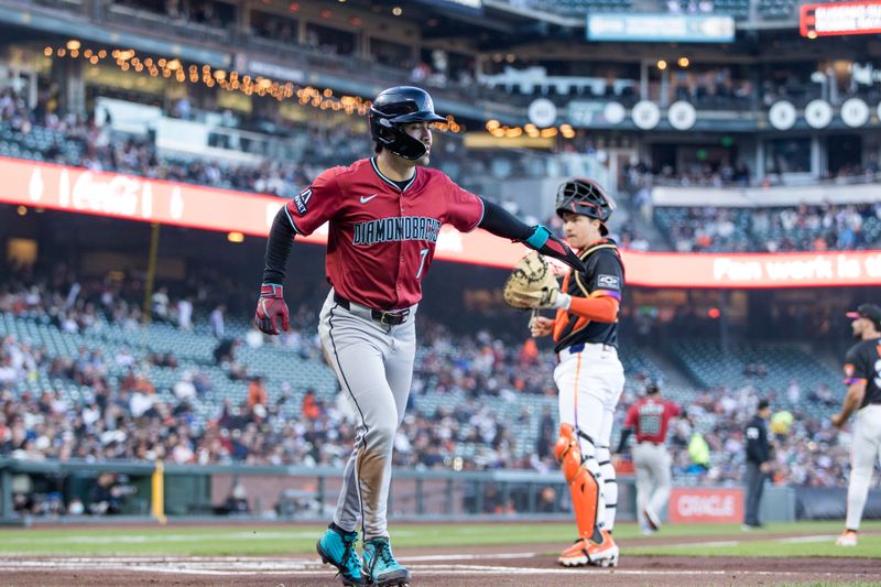May 13, 2025; San Francisco, California, USA; Arizona Diamondbacks right fielder Corbin Carroll (7) scores a run against the San Francisco Giants during the first inning at Oracle Park. Mandatory Credit: John Hefti-Imagn Images