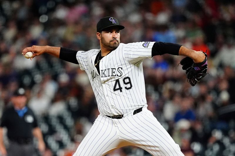 Sep 2, 2025; Denver, Colorado, USA; Colorado Rockies pitcher Antonio Senzatela (49) delivers a pitch in the fourth inning against the San Francisco Giants at Coors Field. Mandatory Credit: Ron Chenoy-Imagn Images