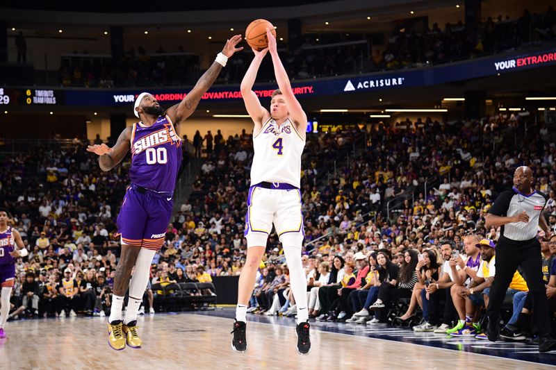 LOS ANGELES, CA - OCTOBER 6: Dalton Knecht #4 of the Los Angeles Lakers shoots a three point basket during the game against the Phoenix Suns on October 6, 2024 at Acrisure Arena in Palm Springs, California. NOTE TO USER: User expressly acknowledges and agrees that, by downloading and/or using this Photograph, user is consenting to the terms and conditions of the Getty Images License Agreement. Mandatory Copyright Notice: Copyright 2024 NBAE (Photo by Adam Pantozzi/NBAE via Getty Images)