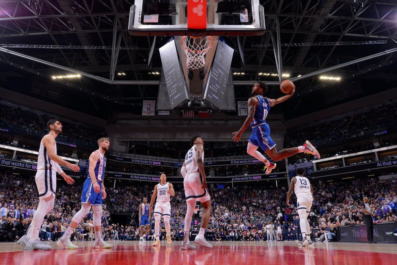 SACRAMENTO, CA - MARCH 18: Malik Monk #0 of the Sacramento Kings dunks the ball during the game against the Memphis Grizzlies on March 18, 2024 at Golden 1 Center in Sacramento, California. NOTE TO USER: User expressly acknowledges and agrees that, by downloading and or using this Photograph, user is consenting to the terms and conditions of the Getty Images License Agreement. Mandatory Copyright Notice: Copyright 2024 NBAE (Photo by Rocky Widner/NBAE via Getty Images)