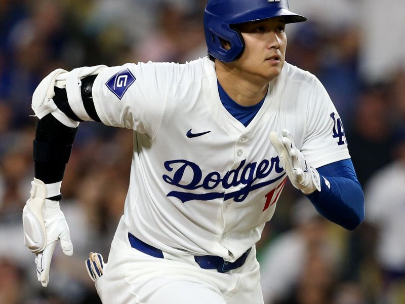 Jul 23, 2024; Los Angeles, California, USA; Los Angeles Dodgers designated hitter Shohei Ohtani (17) hits a two-RBI double during the fourth inning against the San Francisco Giants at Dodger Stadium. Mandatory Credit: Jason Parkhurst-USA TODAY Sports
