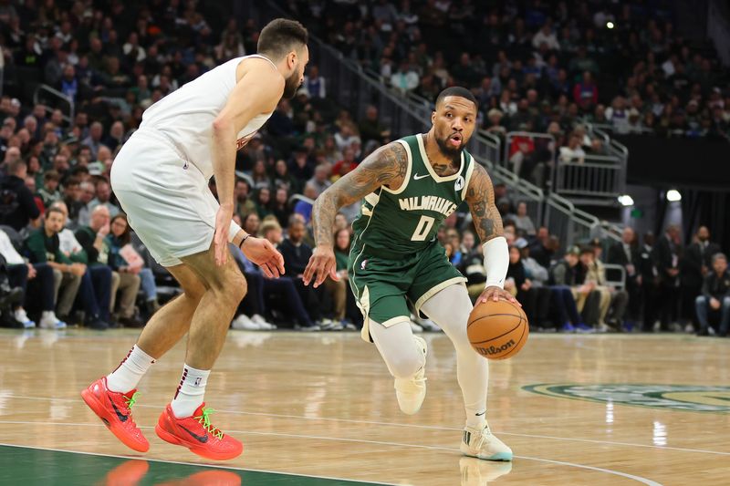 MILWAUKEE, WISCONSIN - JANUARY 24: Damian Lillard #0 of the Milwaukee Bucks is defended by Max Strus #1 of the Cleveland Cavaliers during a game at Fiserv Forum on January 24, 2024 in Milwaukee, Wisconsin. NOTE TO USER: User expressly acknowledges and agrees that, by downloading and or using this photograph, User is consenting to the terms and conditions of the Getty Images License Agreement. (Photo by Stacy Revere/Getty Images)