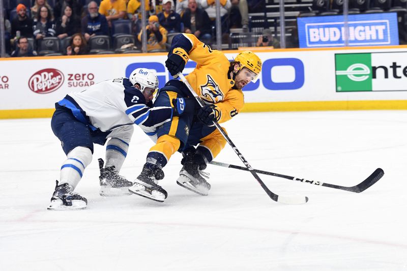 Apr 9, 2024; Nashville, Tennessee, USA; Nashville Predators center Tommy Novak (82) skates past Winnipeg Jets defenseman Dylan DeMelo (2) before scoring during the first period at Bridgestone Arena. Mandatory Credit: Christopher Hanewinckel-USA TODAY Sports