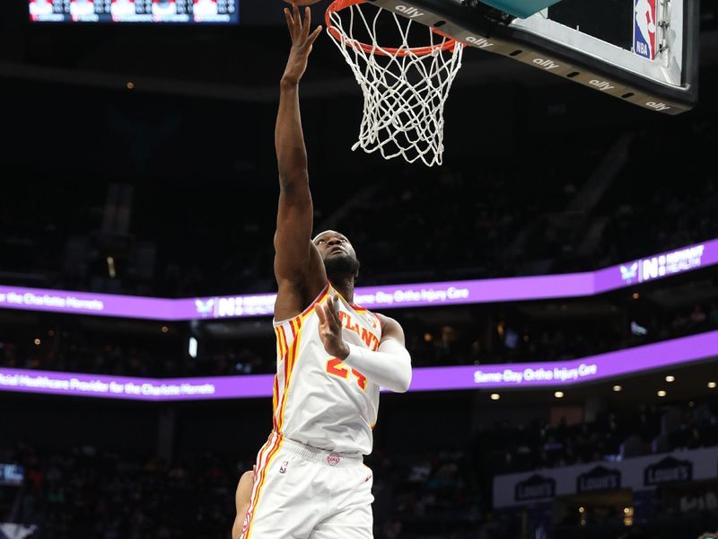 CHARLOTTE, NC - FEBRUARY 14: Bruno Fernando #24 of the Atlanta Hawks drives to the basket during the game against the Charlotte Hornets on February 14, 2024 at Spectrum Center in Charlotte, North Carolina. NOTE TO USER: User expressly acknowledges and agrees that, by downloading and or using this photograph, User is consenting to the terms and conditions of the Getty Images License Agreement.  Mandatory Copyright Notice:  Copyright 2024 NBAE (Photo by Brock Williams-Smith/NBAE via Getty Images)