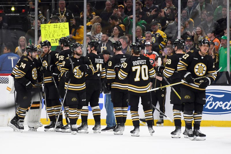 Mar 16, 2024; Boston, Massachusetts, USA; The Boston Bruins celebrate their win over Philadelphia Flyers at TD Garden. Mandatory Credit: Bob DeChiara-USA TODAY Sports