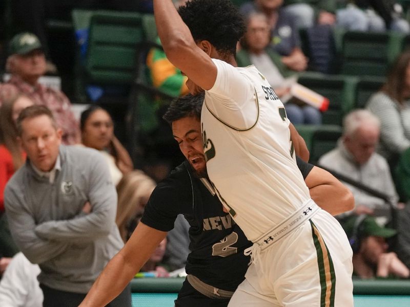 Feb 27, 2024; Fort Collins, Colorado, USA; Nevada Wolf Pack guard Jarod Lucas (2) drives on Colorado State Rams guard Josiah Strong (3) during the first half at Moby Arena. Mandatory Credit: Michael Madrid-USA TODAY Sports