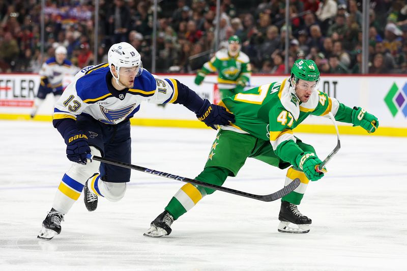 Mar 23, 2024; Saint Paul, Minnesota, USA; St. Louis Blues right wing Alexey Toropchenko (13) and Minnesota Wild defenseman Declan Chisholm (47) compete for the puck during the second period at Xcel Energy Center. Mandatory Credit: Matt Krohn-USA TODAY Sports