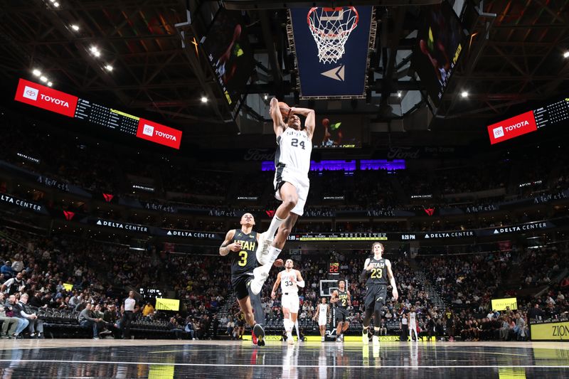 SALT LAKE CITY, UT - MARCH 27: Devin Vassell #24 of the San Antonio Spurs dunks the ball during the game against the Utah Jazz on March 27, 2024 at Delta Center in Salt Lake City, Utah. NOTE TO USER: User expressly acknowledges and agrees that, by downloading and or using this Photograph, User is consenting to the terms and conditions of the Getty Images License Agreement. Mandatory Copyright Notice: Copyright 2024 NBAE (Photo by Melissa Majchrzak/NBAE via Getty Images)