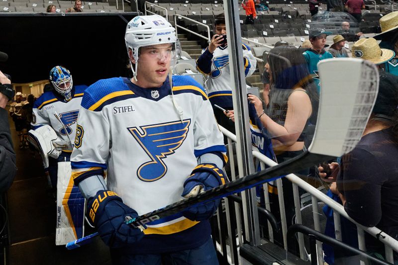 Apr 6, 2024; San Jose, California, USA; St. Louis Blues left wing Jake Neighbours (63) walks to the ice for warmups before the game between the San Jose Sharks and the St. Louis Blues at SAP Center at San Jose. Mandatory Credit: Robert Edwards-USA TODAY Sports