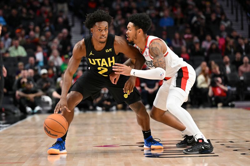 PORTLAND, OREGON - OCTOBER 18: Collin Sexton #2 of the Utah Jazz dribbles the ball while defended by Anfernee Simons #1 of the Portland Trail Blazers during the first quarter of the game at Moda Center on October 18, 2024 in Portland, Oregon. NOTE TO USER: User expressly acknowledges and agrees that, by downloading and or using this photograph, User is consenting to the terms and conditions of the Getty Images License Agreement. (Photo by Alika Jenner/Getty Images)