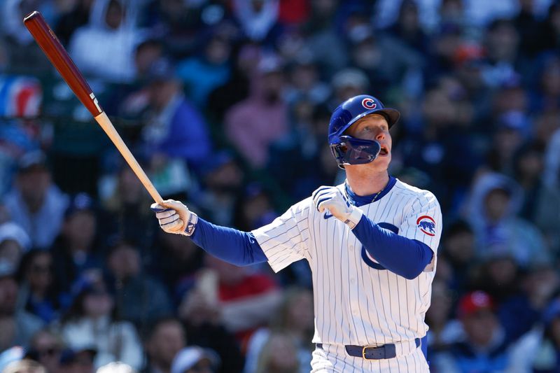 Apr 25, 2024; Chicago, Illinois, USA; Chicago Cubs centerfielder Pete Crow-Armstrong (52) hits a two-run home run against the Houston Astros during the sixth inning at Wrigley Field. Mandatory Credit: Kamil Krzaczynski-USA TODAY Sports
