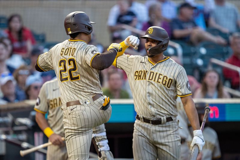 May 10, 2023; Minneapolis, Minnesota, USA; San Diego Padres left fielder Juan Soto (22) celebrates with shortstop Xander Bogaerts (2) after hitting a solo home run in the seventh inning against the Minnesota Twins at Target Field. Mandatory Credit: Jesse Johnson-USA TODAY Sports