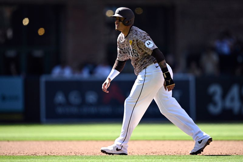 Apr 28, 2024; San Diego, California, USA; San Diego Padres third baseman Manny Machado (13) leads off second base during the eighth inning against the Philadelphia Phillies at Petco Park. Mandatory Credit: Orlando Ramirez-USA TODAY Sports