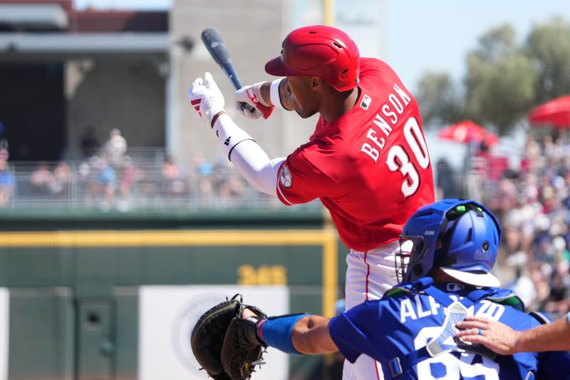 Mar 5, 2026; Goodyear, Arizona, USA; Cincinnati Reds left fielder Will Benson (30) hits a home run against the Los Angeles Dodgers during the first inning at Goodyear Ballpark. Mandatory Credit: Joe Camporeale-Imagn Images