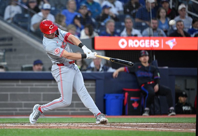 Aug 21, 2024; Toronto, Ontario, CAN;  Cincinnati Reds left fielder Spencer Steer (7) hits a two run home run against the Toronto Blue Jays in the fourth inning at Rogers Centre. Mandatory Credit: Dan Hamilton-USA TODAY Sports