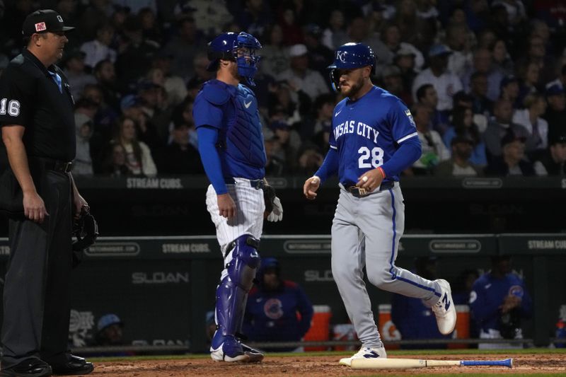 Mar 6, 2025; Mesa, Arizona, USA; Kansas City Royals outfielder Kyle Isbel (28) scores against the Chicago Cubs in the third inning at Sloan Park. Mandatory Credit: Rick Scuteri-Imagn Images