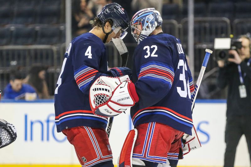 Feb 7, 2024; New York, New York, USA; New York Rangers goaltender Jonathan Quick (32) is greeted by New York Rangers defenseman Braden Schneider (4) after defeating the Tampa Bay Lightning 3-1 at Madison Square Garden. Mandatory Credit: Wendell Cruz-USA TODAY Sports