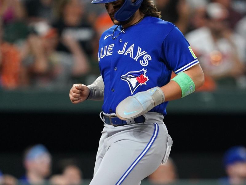 Aug 24, 2023; Baltimore, Maryland, USA; Toronto Blue Jays shortstop Bo Bichette (11) scores in the fourth inning on a hit by outfielder George Springer (not shown) against the Baltimore Orioles at Oriole Park at Camden Yards. Mandatory Credit: Mitch Stringer-USA TODAY Sports