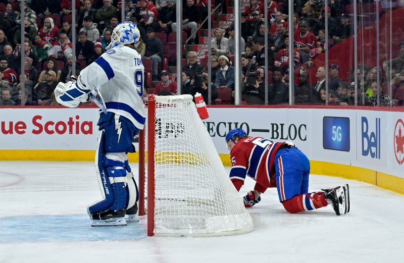 Nov 7, 2023; Montreal, Quebec, CAN; Montreal Canadiens forward Michael Pezzetta (55) injured behind Tampa Bay Lightning goalie Matt Tomkins (90) during the first period at the Bell Centre. Mandatory Credit: Eric Bolte-USA TODAY Sports