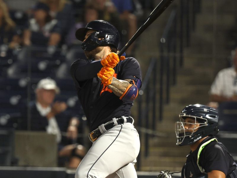 Feb 27, 2023; Tampa, Florida, USA;  Detroit Tigers catcher Eric Haase (13) hits a 2-run home run during the first inning  against the New York Yankees at George M. Steinbrenner Field. Mandatory Credit: Kim Klement-USA TODAY Sports