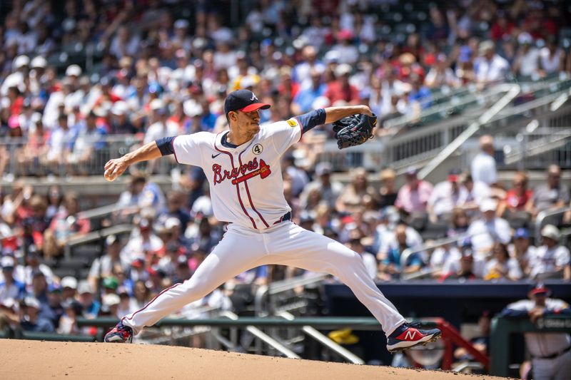 Jun 2, 2024; Cumberland, Georgia, USA; Atlanta Braves pitcher Charlie Morton (50) pitches the ball against Oakland Athletics during the second inning at Truist Park. Mandatory Credit: Jordan Godfree-USA TODAY Sports