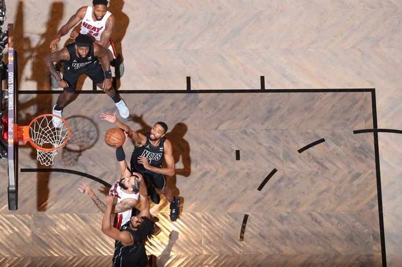 BROOKLYN, NY - JANUARY 15: Caleb Martin #16 of the Miami Heat drives to the basket during the game against the Brooklyn Nets on January 15, 2024 at Barclays Center in Brooklyn, New York. NOTE TO USER: User expressly acknowledges and agrees that, by downloading and or using this Photograph, user is consenting to the terms and conditions of the Getty Images License Agreement. Mandatory Copyright Notice: Copyright 2024 NBAE (Photo by Nathaniel S. Butler/NBAE via Getty Images)