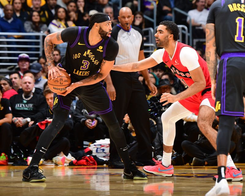 LOS ANGELES, CA - JANUARY 9: Anthony Davis #3 of the Los Angeles Lakers looks to pass the ball during the game against the Toronto Raptors on January 9, 2024 at Crypto.Com Arena in Los Angeles, California. NOTE TO USER: User expressly acknowledges and agrees that, by downloading and/or using this Photograph, user is consenting to the terms and conditions of the Getty Images License Agreement. Mandatory Copyright Notice: Copyright 2024 NBAE (Photo by Adam Pantozzi/NBAE via Getty Images)