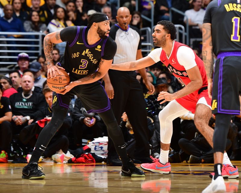 LOS ANGELES, CA - JANUARY 9: Anthony Davis #3 of the Los Angeles Lakers looks to pass the ball during the game against the Toronto Raptors on January 9, 2024 at Crypto.Com Arena in Los Angeles, California. NOTE TO USER: User expressly acknowledges and agrees that, by downloading and/or using this Photograph, user is consenting to the terms and conditions of the Getty Images License Agreement. Mandatory Copyright Notice: Copyright 2024 NBAE (Photo by Adam Pantozzi/NBAE via Getty Images)