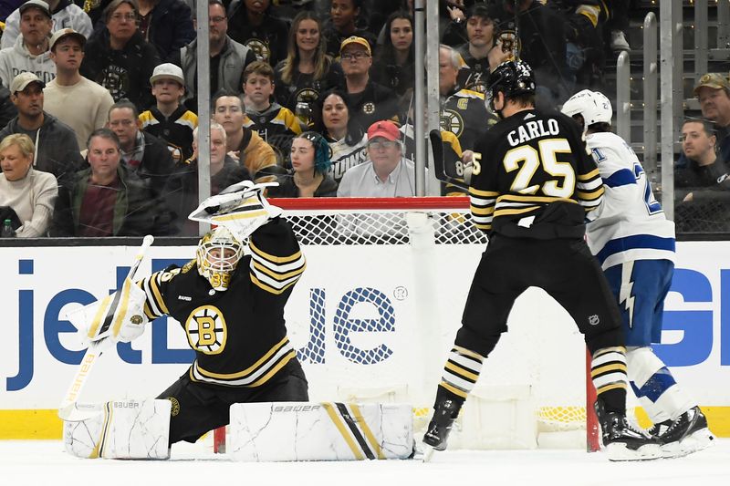 Feb 13, 2024; Boston, Massachusetts, USA;  Boston Bruins goaltender Linus Ullmark (35) makes a glove save during the third period against the Tampa Bay Lightning at TD Garden. Mandatory Credit: Bob DeChiara-USA TODAY Sports