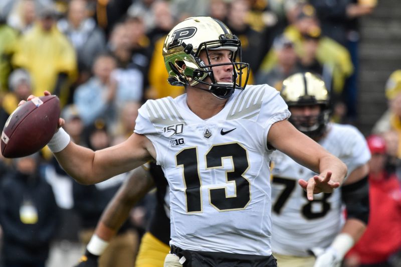 Oct 19, 2019; Iowa City, IA, USA; Purdue Boilermakers quarterback Jack Plummer (13) throws a pass against the Iowa Hawkeyes during the first quarter at Kinnick Stadium. Mandatory Credit: Jeffrey Becker-USA TODAY Sports