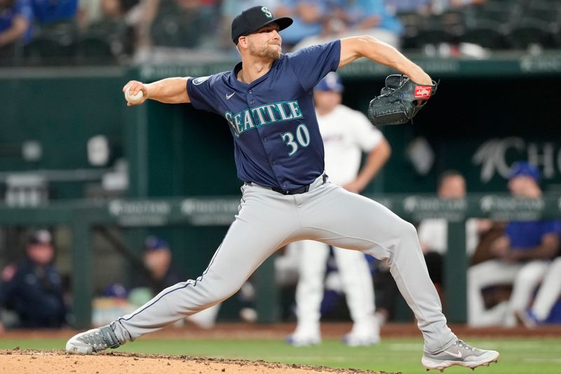 Apr 24, 2024; Arlington, Texas, USA; Seattle Mariners pitcher Austin Voth (30) pitches to the Texas Rangers during the eighth inning at Globe Life Field. Mandatory Credit: Jim Cowsert-USA TODAY Sports