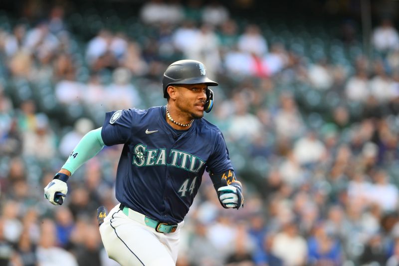 Jun 10, 2024; Seattle, Washington, USA; Seattle Mariners center fielder Julio Rodriguez (44) runs towards first base after hitting a single against the Chicago White Sox during the fourth inning at T-Mobile Park. Mandatory Credit: Steven Bisig-USA TODAY Sports