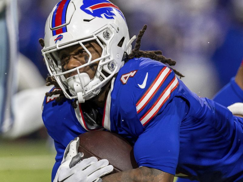 Buffalo Bills running back James Cook (4) runs the ball against the Dallas Cowboys in an NFL football game, Sunday, Dec. 17, 2023, in Orchard Park, NY. Bills defeated the Cowboys 31-10.(AP Photo/Jeff Lewis)