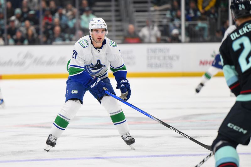 Nov 24, 2023; Seattle, Washington, USA; Vancouver Canucks left wing Nils Hoglander (21) during the third period against the Seattle Kraken at Climate Pledge Arena. Mandatory Credit: Steven Bisig-USA TODAY Sports