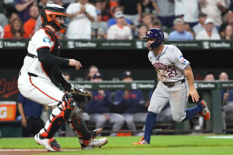 Aug 22, 2024; Baltimore, Maryland, USA; Houston Astros second baseman Jose Altuve (27) rounds the bases to score during the fourth inning defended by Baltimore Orioles catcher Adley Rutschman (35) at Oriole Park at Camden Yards. Mandatory Credit: Mitch Stringer-USA TODAY Sports