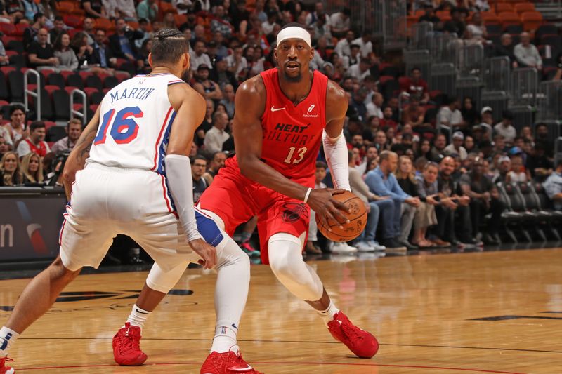 MIAMI, FL - NOVEMBER 18: Bam Adebayo #13 of the Miami Heat handles the ball during the game against the Philadelphia 76ers on November 18, 2024 at Kaseya Center in Miami, Florida. NOTE TO USER: User expressly acknowledges and agrees that, by downloading and or using this Photograph, user is consenting to the terms and conditions of the Getty Images License Agreement. Mandatory Copyright Notice: Copyright 2024 NBAE (Photo by Issac Baldizon/NBAE via Getty Images)