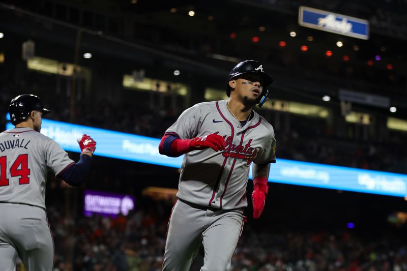 Aug 12, 2024; San Francisco, California, USA; Atlanta Braves shortstop Orlando Arcia (11) scores a run during the tenth inning against the San Francisco Giants at Oracle Park. Mandatory Credit: Sergio Estrada-USA TODAY Sports