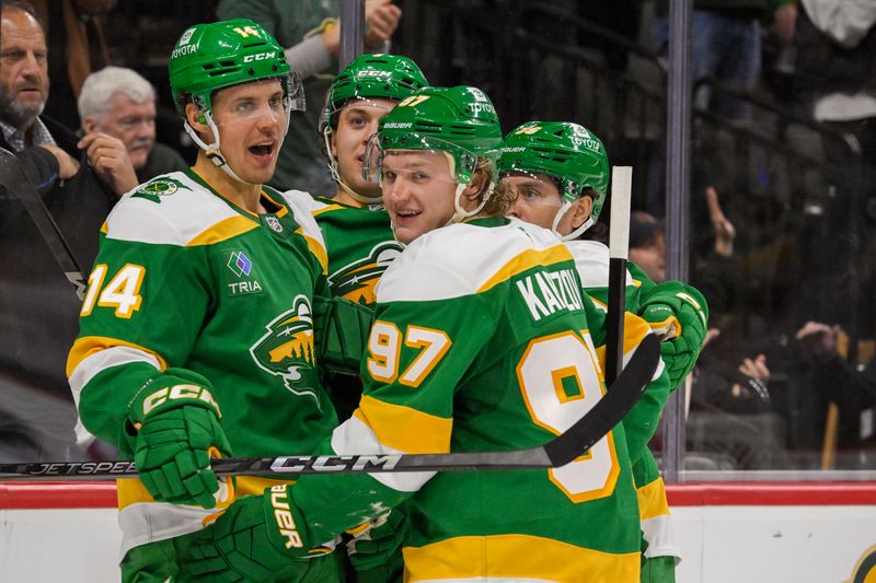 Nov 1, 2024; Saint Paul, Minnesota, USA;  Minnesota Wild forward Joel Eriksson Ek (14) celebrates his goal against the Tampa Bay Lightning with defenseman Brock Faber (7), forward Mats Zuccarello (36), and forward Kirill Kaprizov (97) during the second period at Xcel Energy Center. Mandatory Credit: Nick Wosika-Imagn Images