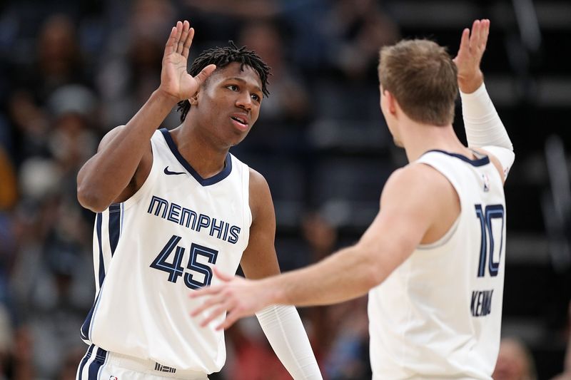 MEMPHIS, TENNESSEE - MARCH 13: GG Jackson #45 of the Memphis Grizzlies and Luke Kennard #10 celebrate during the second half against the Charlotte Hornets at FedExForum on March 13, 2024 in Memphis, Tennessee. NOTE TO USER: User expressly acknowledges and agrees that, by downloading and or using this photograph, User is consenting to the terms and conditions of the Getty Images License Agreement. (Photo by Justin Ford/Getty Images)