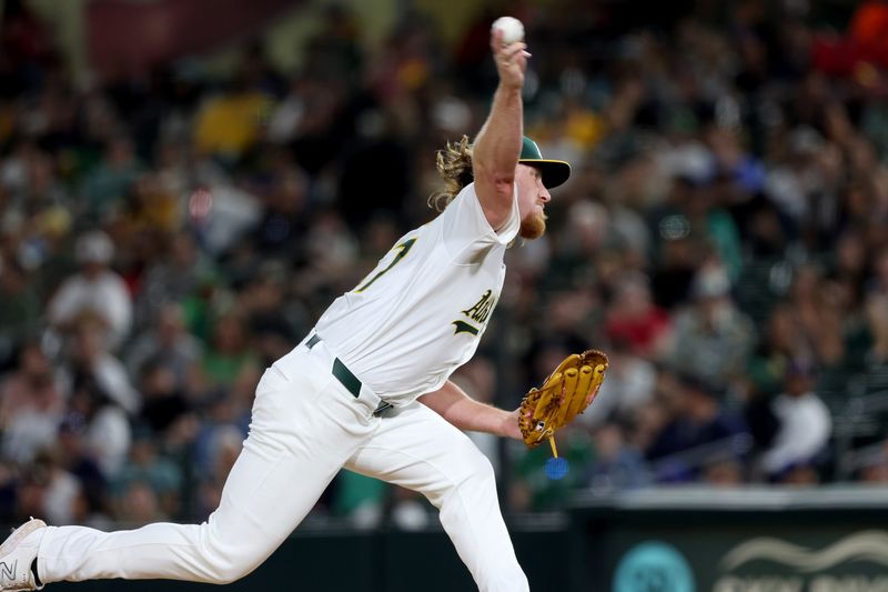 May 5, 2025; West Sacramento, California, USA; Athletics pitcher Grant Holman (67) throws against the Seattle Mariners during the seventh inning at Sutter Health Park. Mandatory Credit: Dennis Lee-Imagn Images