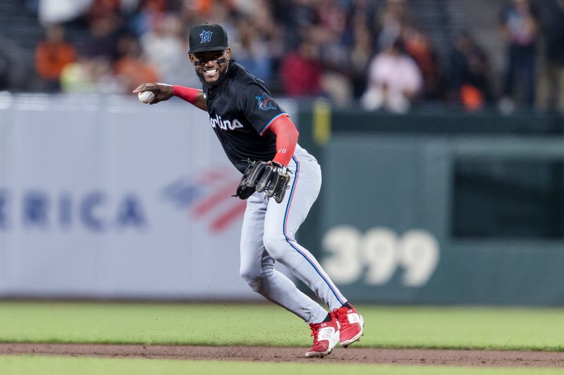 Aug 30, 2024; San Francisco, California, USA; Miami Marlins shortstop Vidal Brujan (17) throws to first base for an out against the San Francisco Giants during the sixth inning at Oracle Park. Mandatory Credit: John Hefti-USA TODAY Sports